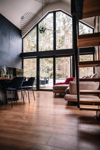a living room with a couch and a table at Zakątek Lipowy Most in Lipowy Most