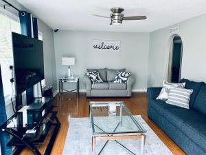 a living room with a couch and a table at Hartsfield Jackson Escape in College Park