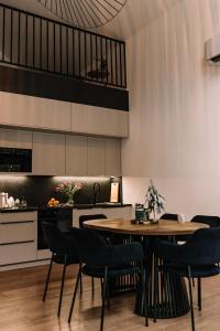 a kitchen and dining room with a table and chairs at Zakątek Lipowy Most in Lipowy Most
