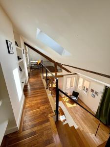 an attic staircase with a skylight in a house at Duplex château de Versailles - 30 min de Paris in Versailles