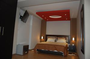 Postel nebo postele na pokoji v ubytování Plaza Sur Hotel & Suites
