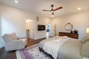a bedroom with a bed and a chair and a mirror at Cliff's View Mountain Retreat in Luray