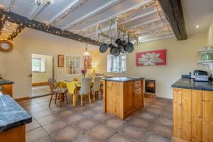 a kitchen and dining room with a table and chairs at 4 Bed in East Harling oc-m31907 in East Harling