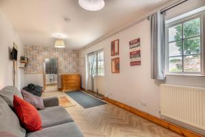 a living room with a couch and a window at 4 Bed in East Harling oc-m31907 in East Harling