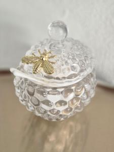 a glass jar with pearl buttons and a bow on it at The Suite at O'Shea's in Killorglin