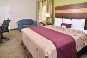 Ένα ή περισσότερα κρεβάτια σε δωμάτιο στο Americas Best Value Inn Downtown Houston