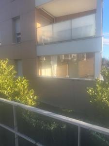 a view of a building from a balcony at Résidence inside in Ferney-Voltaire