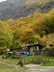 a house on the side of a mountain at Camping el Cares in Santa Maria de Valdeón