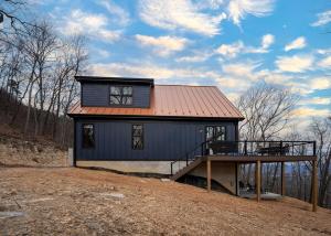 a small house with a roof on a hill at Cliff's View Mountain Retreat in Luray
