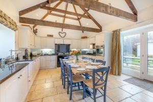 a kitchen with a table and chairs in a kitchen at 3 Bed in nr Beadnell oc-cr1279 in Beadnell