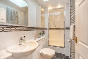 a bathroom with a sink and a toilet and a shower at 3 Bed in nr Beadnell oc-cr1279 in Beadnell +26 photos
