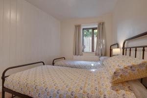 a bedroom with two beds and a window at 2 Bed in Settle oc-ds1038 in Settle