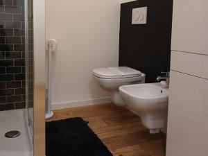 a small bathroom with a toilet and a sink at Il monolocale in Bosisio Parini +37 photos