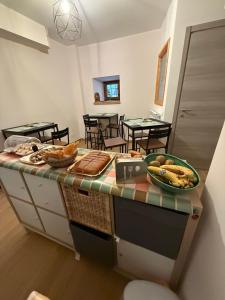 a kitchen with a table with some food on it at Le Coste in Villetta Barrea