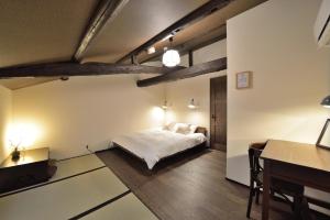 Cama ou camas em um quarto em Takeya Gojo