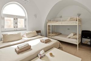 a bedroom with two bunk beds and a window at The Downtown Getaway Studio in Hurghada