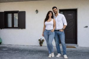 a man and a woman standing in front of a house at Anna&Franco Guest House in Isernia