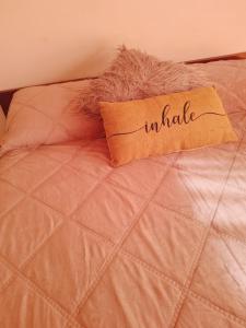 a pillow with the wordwhatever written on it on a bed at Bahia Rental 11-Departamento x dia con cochera in Bahía Blanca