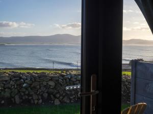 a view from a window of the ocean at Bayview Glamping Pods Kerry in Ballyheigue