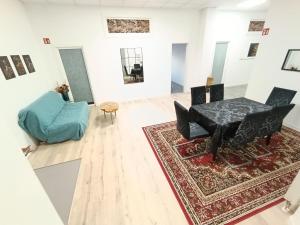 a living room with a table and a chair at 1 bedroom apartment 2 guests in Aschaffenburg