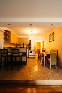 a kitchen and dining room with a table and chairs at Grahovo Lake in Čelina +40 photos