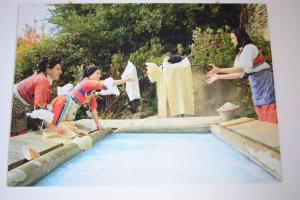a group of women standing around a pool of water at Fidelica in Stintino