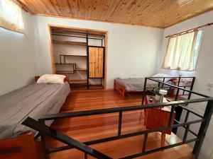 a small room with two beds and a balcony at Elvira in Estación Circunvalación