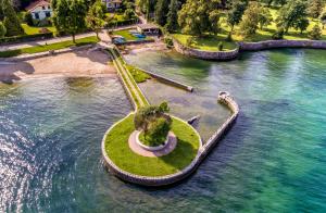 an island in the middle of a body of water at Casa Mora in Cerro Lago Maggiore