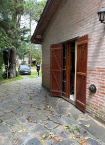 a building with open doors and a stone patio at OKIN 26 Unica in Costa del Este