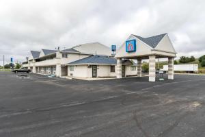 a large gas station with a number four at Motel 6-Crawfordsville, IN in Crawfordsville