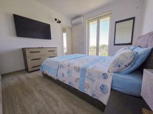 a bedroom with a bed and a dresser at GHouse in Gallipoli +22 photos