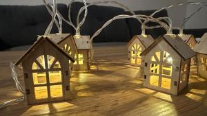 a group of houses with lights on a table at Sky View - Apartment & GARAGE, Banja Luka in Banja Luka