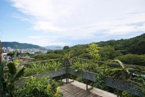a balcony with a view of a city at Casa Rover - Floripa in Florianópolis