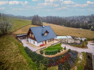 an aerial view of a house with a garden at Roubenka Pastvina in Rudník