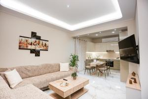 a living room with a couch and a table at Luxury and Cozy Chios in Chios
