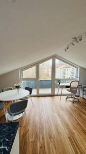 an empty office with a table and chairs in a room at Luxury Apartment in Böblingen in Böblingen