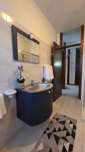 a bathroom with a sink and a mirror at Al Melograno - Villetta - Gussago - Franciacorta in Gussago +56 photos