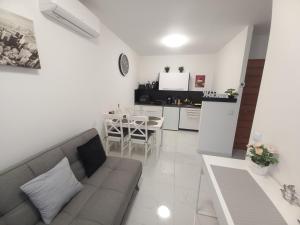 a living room with a couch and a table at JULIANNA APARTMAN Budapest FREE PARKING in Budapest +11 photos