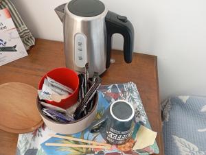 a coffee maker sitting on top of a table at La maison de J et B étage entier in Tarbes