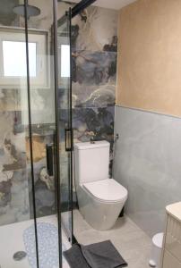 a bathroom with a toilet and a shower at PORTA AUREA Našice in Našice +5 photos