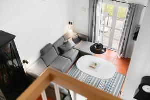 a living room with a couch and a table at BV435-Blavand-Horns-Bjerge-3-59 in Blåvand +14 photos