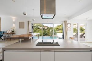 a kitchen with a view of a living room at Villa Angel Sunset in Gustavia