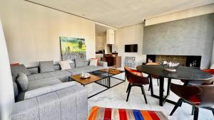a living room with a couch and a table at Cozy appartement Marrakech in Marrakesh
