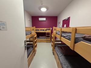 a room with three bunk beds and a door at Les Terrasses du Rhône, Baix in Baix +3 photos