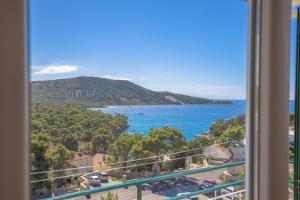 a view of the ocean from a balcony at Apartmani Jurin in Primošten