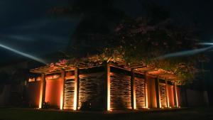 a building with lights on it at night at Pousada O Canto do Francês in Soure