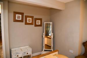a room with a mirror on the wall and a dresser at No6 @ Globe Lane,Alston in Alston