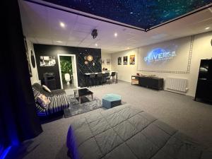 a bedroom with a bed and a living room at Studio La Bobine in Coincy
