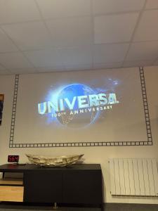 a large sign on the wall of a building at Studio La Bobine in Coincy +2 photos