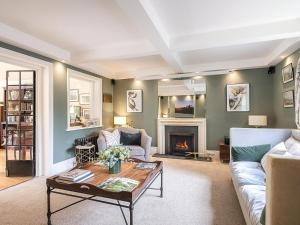 a living room with a couch and a fireplace at 5 Bed in Devizes oc-s34742 in Devizes